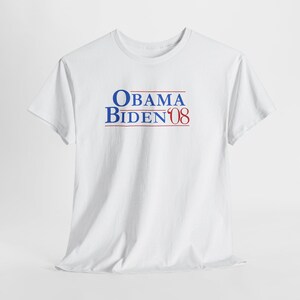 May include: White t-shirt with the text "OBAMA BIDEN 08" in blue and red. The text is centered on the front of the shirt. The shirt is made of a soft material and has short sleeves.