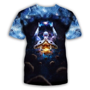 May include: A blue and black t-shirt with a graphic print of a person with their arms raised, holding a glowing orb. The background is a galaxy with stars and planets.