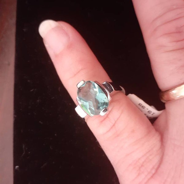 Aquamarine CZ set in platinum plated sterling silver,Size 7.