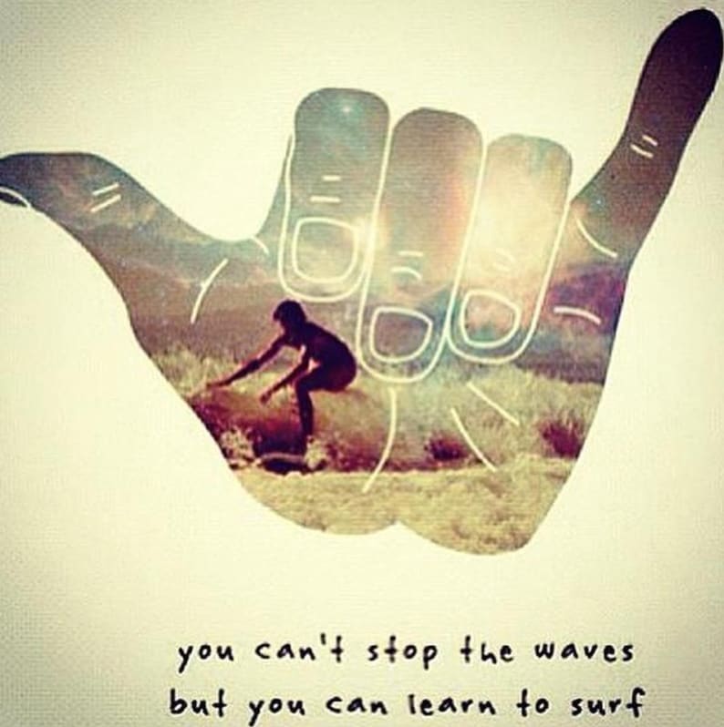 May include: A hand drawn in the style of a shaka sign with a surfer riding a wave inside the hand. The text below reads "you can't stop the waves but you can learn to surf".