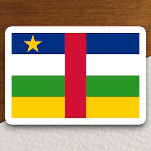 May include: A sticker featuring the flag of the Central African Republic. The flag is a horizontal tricolor of blue, white, and green, with a red vertical stripe in the center. A yellow star is in the upper left corner of the blue stripe.