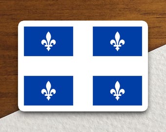 May include: A rectangular sticker featuring the flag of Quebec. The flag design includes four blue squares with a white fleur-de-lis in each, set against a white cross on a blue background. The sticker is on a wooden surface.