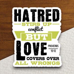 May include: Black and white sticker with the text "HATRED STIRS UP conflict BUT LOVE COVERS OVER ALL WRONGS" with the scripture reference "PROVERBS 10:12" in a smaller font.