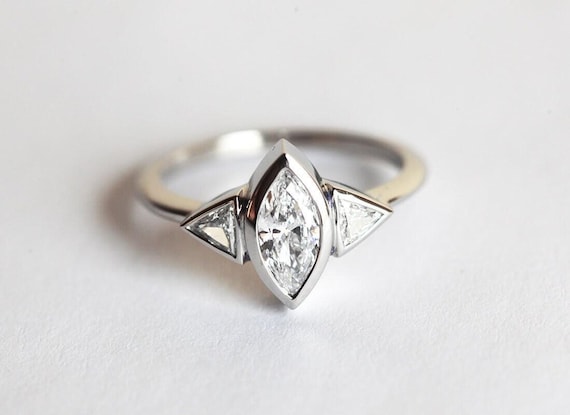 Platinum Marquise Diamond Engagement Ring: Three Stone Trillion Cut, 0.7 Carat