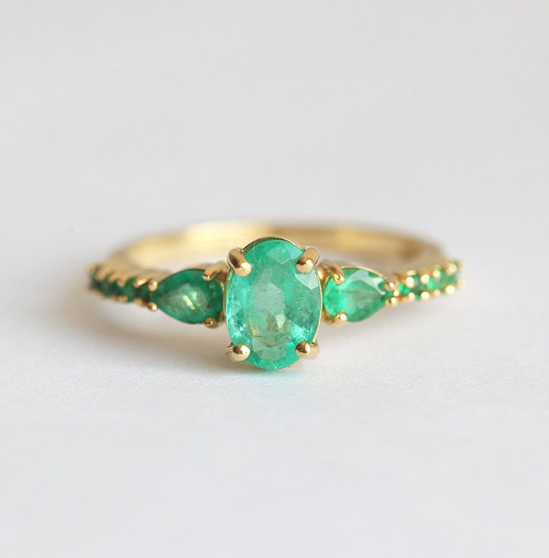 Oval Emerald Cluster Ring in 18k Solid Gold, 6mm Oval Center Stone with Four Prongs, Side Pear and Round Stones image 2