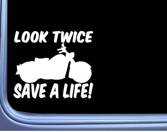 May include: White vinyl decal with the text "Look Twice Save A Life!" and a silhouette of a motorcycle.
