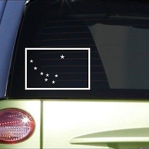 May include: A white vinyl sticker of the flag of the US state of Alaska. The flag is a dark blue rectangle with a white constellation of eight stars in the shape of the Big Dipper.