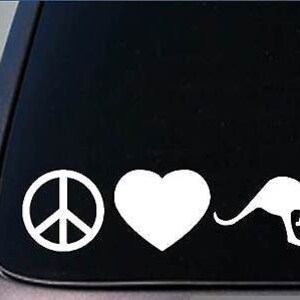 May include: Peace sign, heart, and kangaroo silhouette in white on a black background.  This is a vinyl decal sticker.