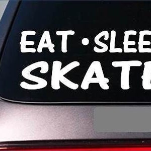 May include: White vinyl decal with the text "Eat - Sleep Skate" on a black car window.