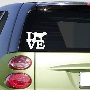 May include: White vinyl car decal with the word "LOVE" in a stylized font. The letter "O" is replaced with the silhouette of a dog.