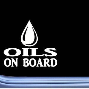 May include: White vinyl decal with a stylized oil drop and the text "OILS ON BOARD".