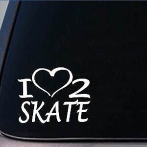 May include: White vinyl decal with the text "I heart 2 skate" with a heart symbol replacing the word "heart".