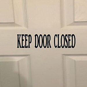May include: White door with a black vinyl sticker that reads "KEEP DOOR CLOSED".