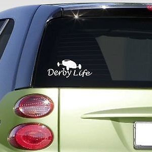 May include: White vinyl decal of a derby car with the text "Derby Life" on a green car.