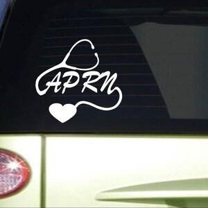 May include: White vinyl sticker with a stethoscope design and the text "APRN" on a car window.