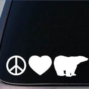 May include: White vinyl decal with a peace sign, heart, and polar bear silhouette. The decal is on a black background.