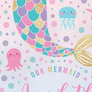 May include: A pink, purple, and turquoise mermaid tail with gold glitter scales. The tail is on a light pink background with white polka dots, stars, and sea creatures. The text "OUR MERMAID" is written in pink, purple, and turquoise letters.
