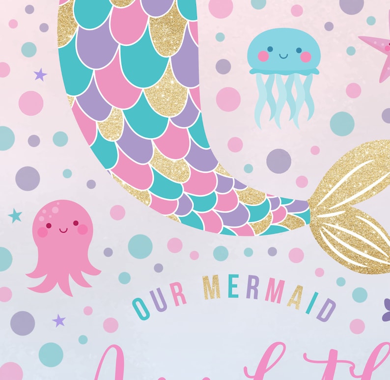 May include: A pink, purple, and turquoise mermaid tail with gold glitter scales. The tail is on a light pink background with white polka dots, stars, and sea creatures. The text "OUR MERMAID" is written in pink, purple, and turquoise letters.