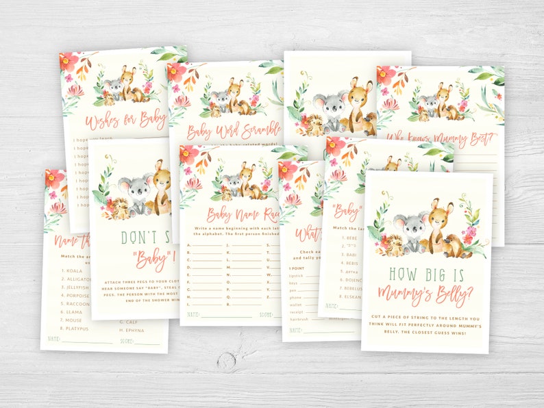 May include: A set of printable baby shower games featuring a cute koala and deer illustration with pink and green floral accents. The games include "Baby Word Scramble", "Don't Say "Baby"!, "Who Knows Mummy Best?", "Baby Name Race", "What's in Mummy's Purse?", "How Big is Mummy's Belly?" and "Name That Animal".