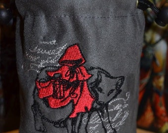 May include: Gray velvet dice bag with a red embroidered image of Little Red Riding Hood and a wolf. The bag has a drawstring closure.