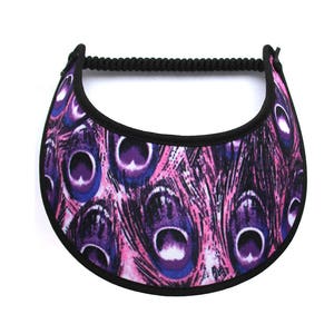 May include: A pink and purple sun visor with a peacock feather pattern.