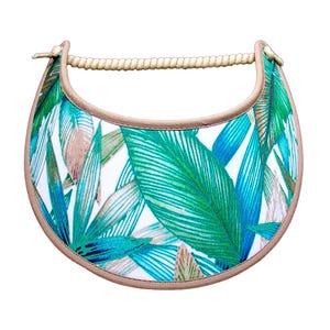 May include: A sun visor with a tropical leaf pattern in shades of green, blue, and tan on a white background. The visor has a tan trim and a rope-style handle.