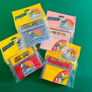 Original 1981 Smurf and Smurfette Wallets in original packaging