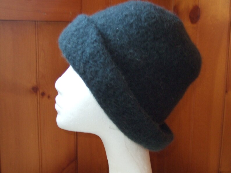May include: A dark gray slouchy beanie hat made of soft, fuzzy material.