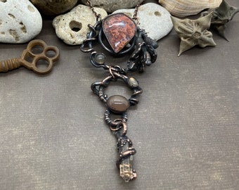 Copper Electroformed Moroccan Seam Agate accented with Labradorite, Peach Moonstone and an Ametrine point.