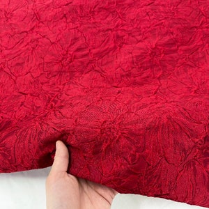 Bright red glossy fabric, concave and convex large jacquard designer fabric, dress skirt vest fabric