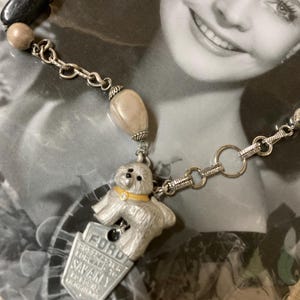 how much is that LITTLE DOGGIE in the window upscaled mixed media dog tag and brooch vintage assemblage necklace repurposed altered art