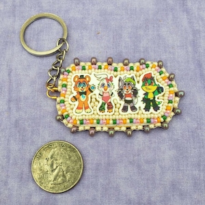 Five Nights at Freddy&#39;s Glam Rock Freddy and Friends Keychain