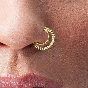 Nose Ring Indian Style Dainty Hoop: A close-up of a person's face, focusing on their nose and lips.