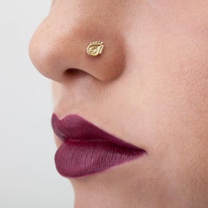 A close-up of a person's face, focusing on their lips and nose.