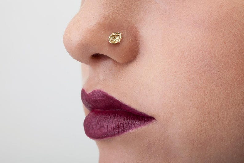 A close-up of a person's face, focusing on their lips and nose.