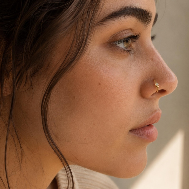 A close-up of a woman's face, focusing on her nose and cheek area.