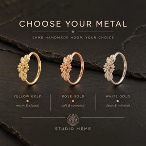 three rings with different colored metal, each with a unique design, arranged on a dark surface.