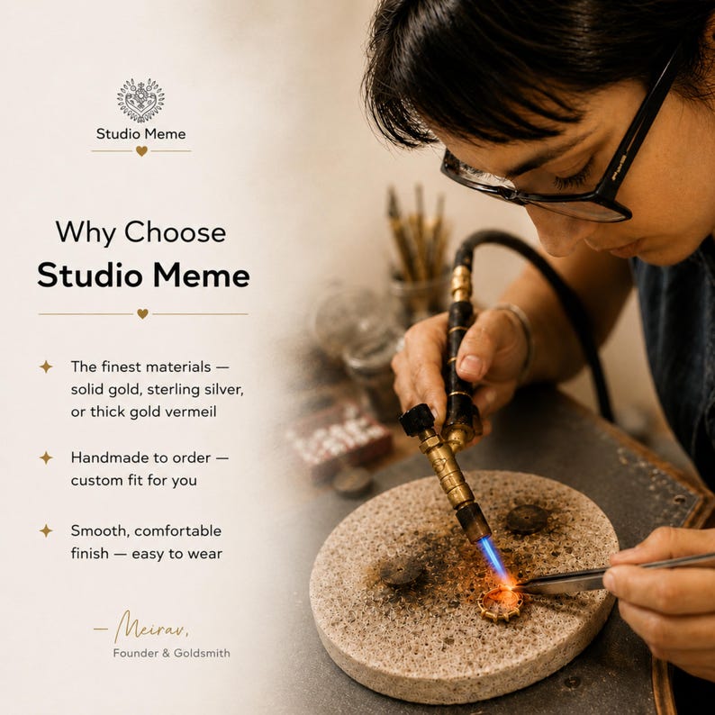 a person working on a piece of jewelry, using a torch to shape and manipulate the material. The person is wearing glasses and appears to be focused on their work.
