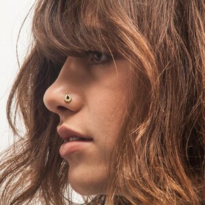 A close-up of a person's face, focusing on their nose and facial features.
