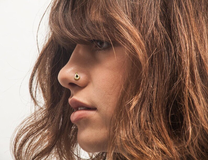 A close-up of a person's face, focusing on their nose and facial features.
