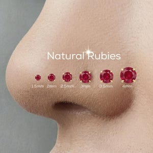 May include: An image displays a series of natural ruby nose studs in varying sizes, from 1.5mm to 4mm. Each ruby is set in a gold bezel, showcasing the vibrant red gemstones. The text "Natural Rubies" is displayed above the studs.