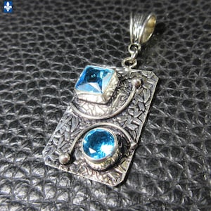 Pretty Blue Topaze and .925 Plated Silver Rectangular Pendant