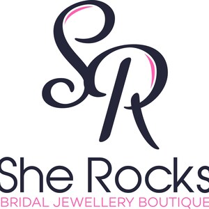May include: Logo for She Rocks Bridal Jewellery Boutique, featuring a stylized black and pink "SR" monogram.