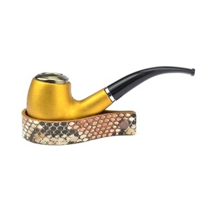 May include: A gold-colored pipe with a black stem and a snakeskin-patterned leather case.