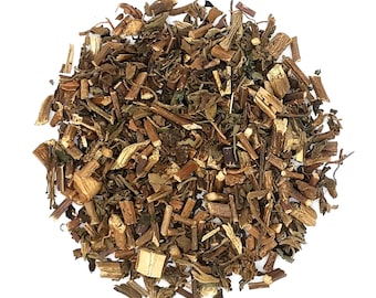 May include: A circular pile of loose-leaf herbal tea consisting of small, dried brown woody twigs, bark fragments, and dark green dried leaves. The mixture features varied textures and earthy brown tones, arranged in a dense, scattered cluster.