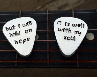 Hand stamped guitar pick