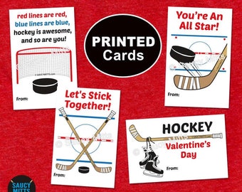 May include: Four printable hockey-themed Valentine's Day cards with different messages. The cards feature hockey sticks, pucks, and nets. The messages include "You're an All Star!" "Let's Stick Together!" "Hockey Valentine's Day" and "Red lines are red, blue lines are blue, hockey is awesome, and so are you!"