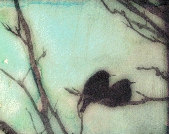 May include: A watercolor painting of three black birds perched on branches against a light blue and green background. The branches are bare and the birds are silhouetted against the sky.