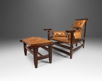 May include: A brown leather armchair with a rope seat and a matching footstool. The chair has a high back and a curved frame.