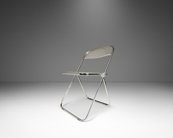 May include: A silver folding chair with a clear plastic seat and back.